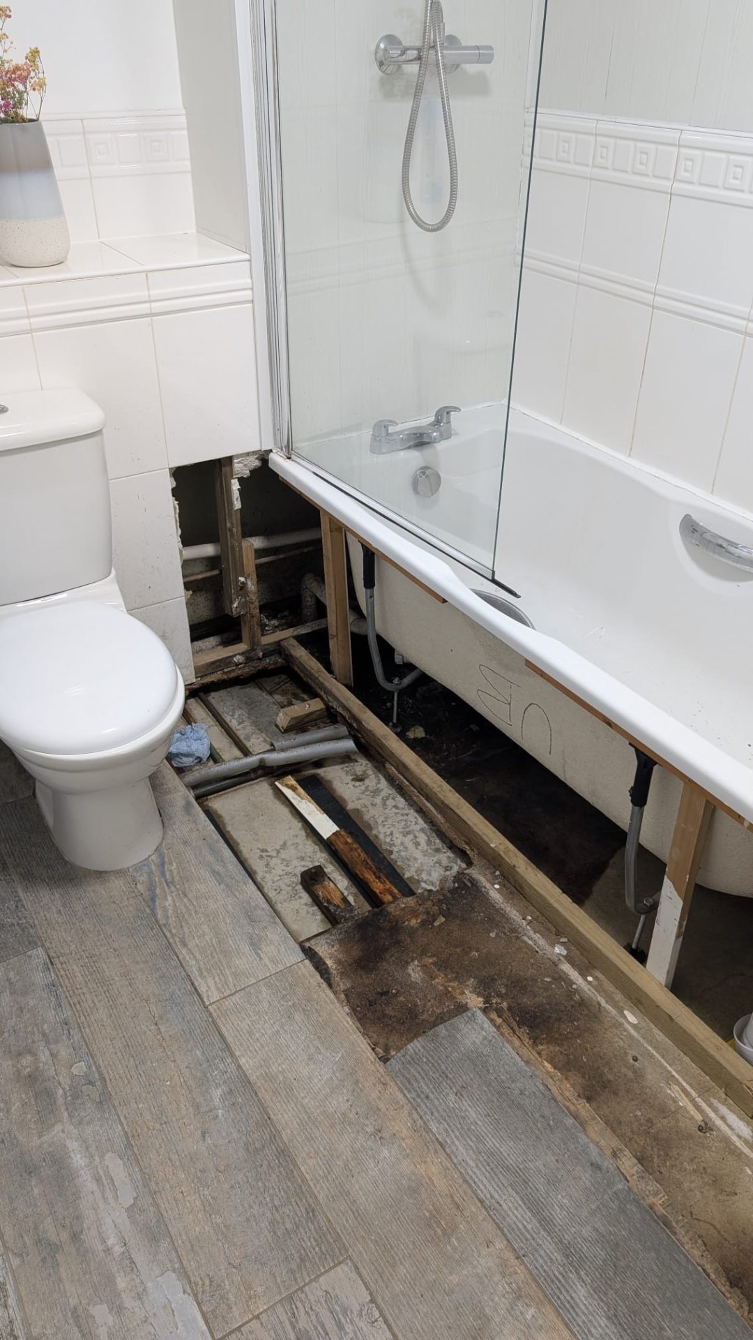 Bathroom leak repair with floorboards lifted in Glasgow